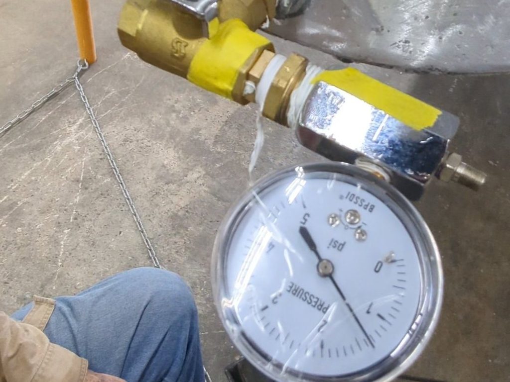 Pressure gauge fitted to a pontoon tube during a leak test
